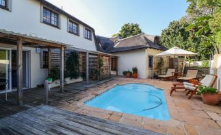 Stunning Guest House For Sale in Plettenberg Bay located within walking distance of the beach