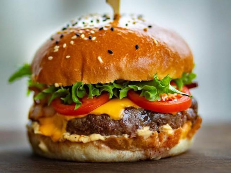 Busy fast-food outlet serving pizzas and burgers with strong daily foot traffic and loyal customers