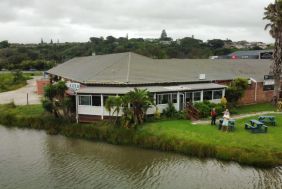 Coastal restaurant on a tranquil river offering fine food and 19 slot machines for entertainment