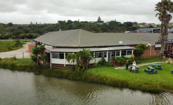 Coastal restaurant on a tranquil river offering fine food and 19 slot machines for entertainment