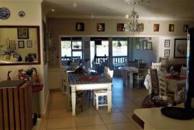 Coastal restaurant on a tranquil river offering fine food and 19 slot machines for entertainment